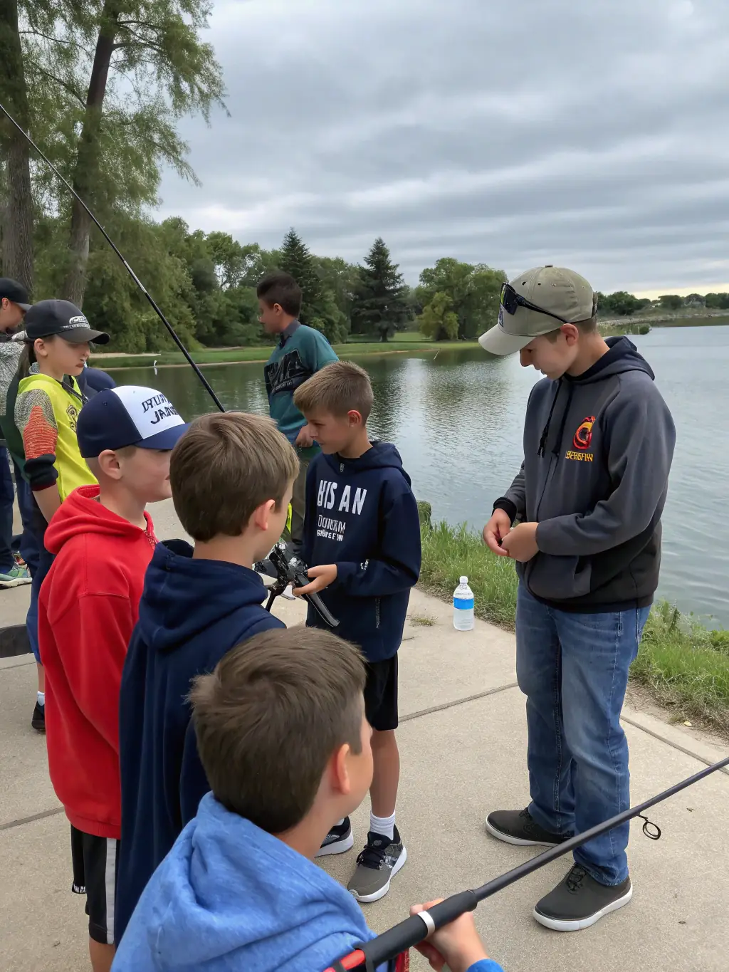 An image of an experienced fishing guide demonstrating a technique to a group of ASCA members, showcasing the expert guidance provided by the club.